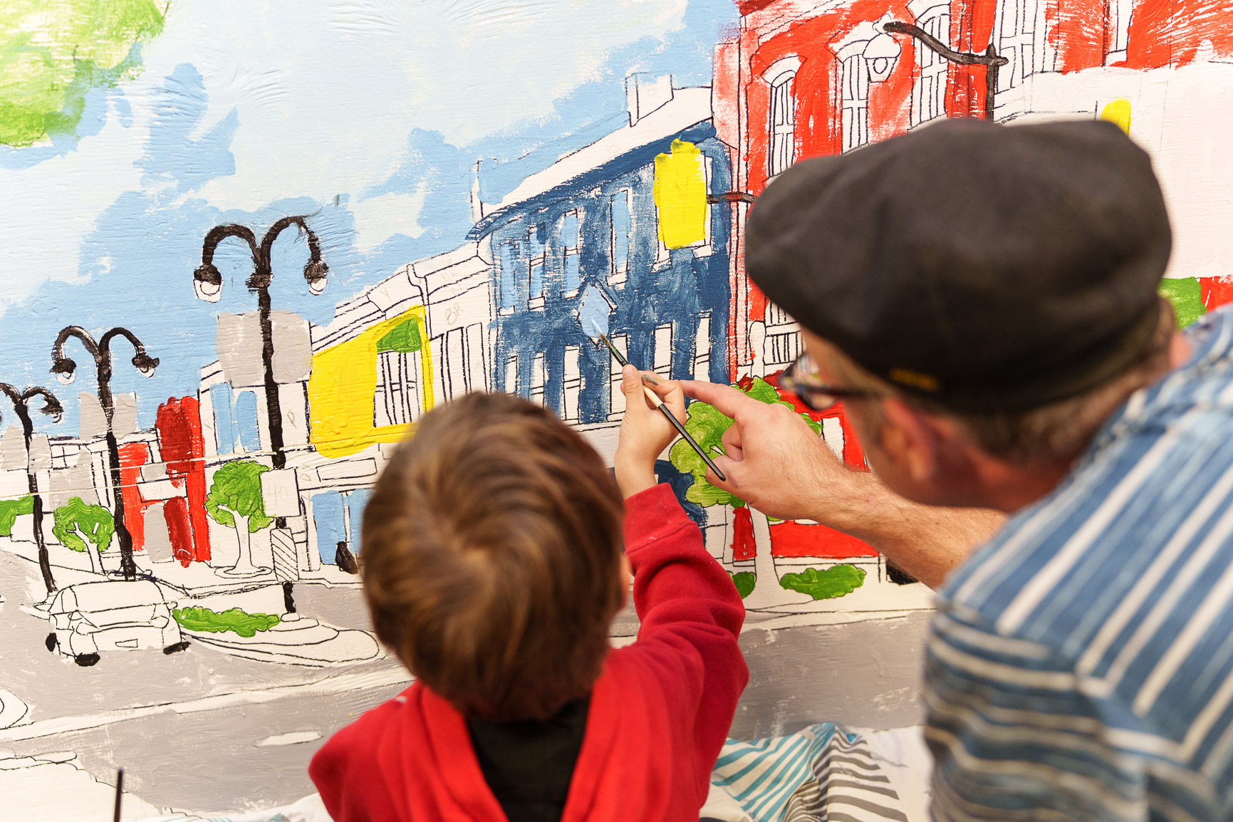 Participants looking at clay pieces